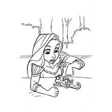 Chameleon lying on its back next to a young woman coloring page