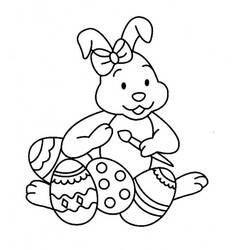 Bunny painting Easter eggs coloring page