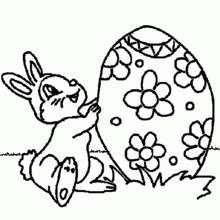 Bunny pushing a giant decorated egg coloring page