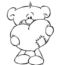 Teddy bear holding a patched heart coloring page
